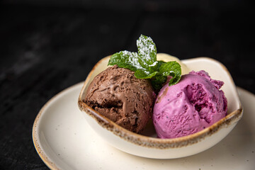 ice cream with chocolate and mint on a wooden background.
