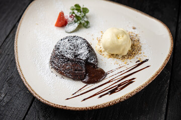 chocolate cake with cream on a wooden background