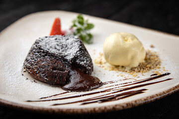 chocolate cake with cream on a wooden background