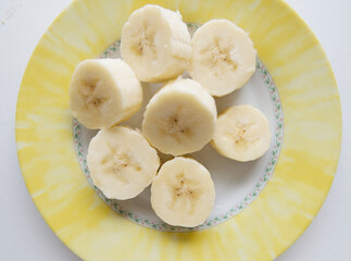 Banana bunch and peeled pieces  photo Tropical fruits, banana snack or vegetarian nutrition.  Top view
