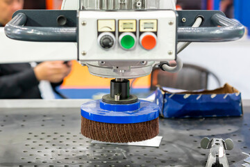 close up sanding paper flap wheel or abrasive disc of deburring polishing buffing machine for dust...