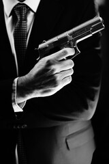 Elegant man holding gun