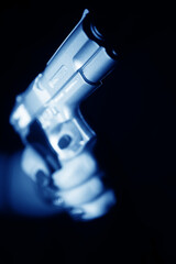 Naklejka premium Woman holding pistol gun