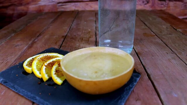 zoom in shot and bottle of mezcal