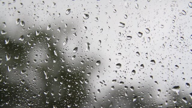 Rain Drops Falling down on black background,High quality footage of Rain on Window Sky Drops, Close up Slow Rain, Rainy at night, Heavy Rainfall. Raining at night.