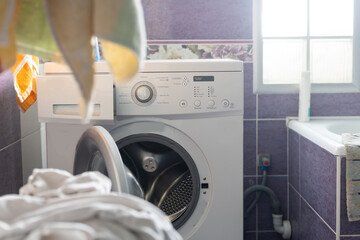 Fototapeta na wymiar washing machine broken in the bathroom