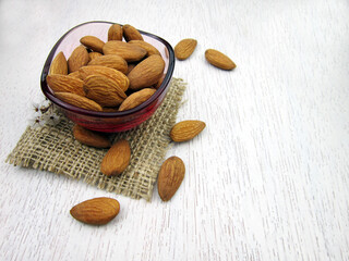        almonds in a bowl on wooden table                        