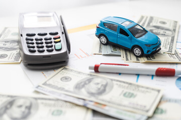 Car insurance concept. car model drive on money with insurance paper background