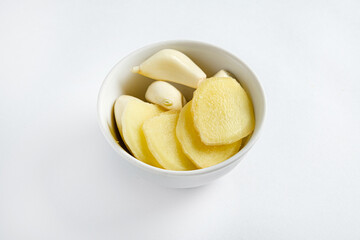 garlic and ginger in the white bowl