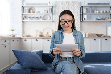 Young beautiful asian female student received happy letter from university, teenage girl received...
