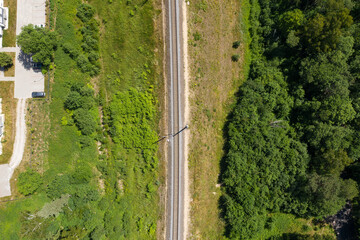 Railway through summer forest. Aerial view