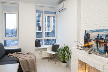 Stylish interior design of living room with modern mint sofa, wooden console, cube, coffee table, lamp, plant, mock up poster frame, pillows, plaid, decoration and elegant accessories in home decor