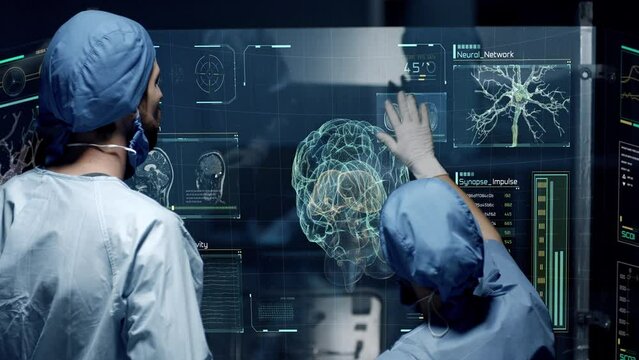 Professional Doctors Analyzing Human Brain Anatomy Scan on Futuristic Touch Screen Interface showing neurons, MRI scans, neural network activity and data. Concept: In the Near Future of Medicine