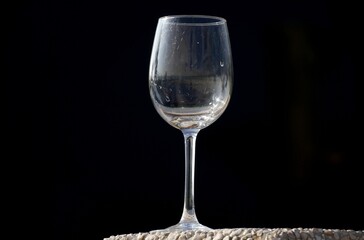 Glass of champagne on black background