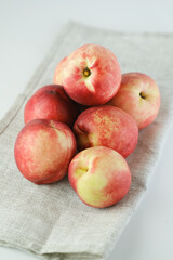 Apple nectarine - Nectarine crossed with apple, on a white table.