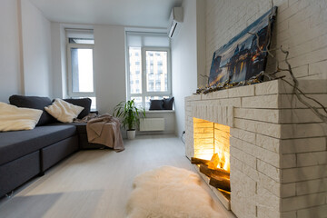 Fototapeta premium Bright living room interior with fireplace