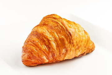 single fresh croissant on white