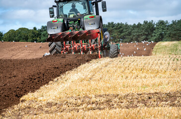  A tractor ploughing  in the Scottish Borders - obrazy, fototapety, plakaty