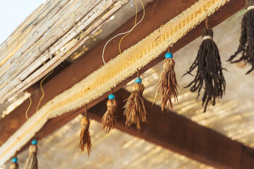 Old tissue fringe on the counter of the merchant. Fringe from the carpet on the street stall