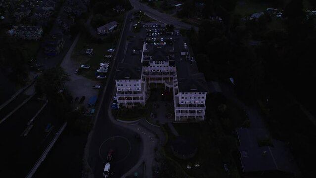 Aerial drone footage boats in harbour at sunset, Sooke BC, sail boats, marina, sunset sky. 5.4K TO 4K 24FPS.