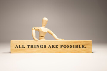 All things are possible written on wooden surface. Motivation and personal development.