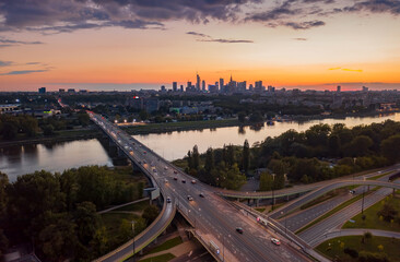 Stunning sunset skyline, aerial view Warsaw, Poland. Drone shot of city downtown business center...