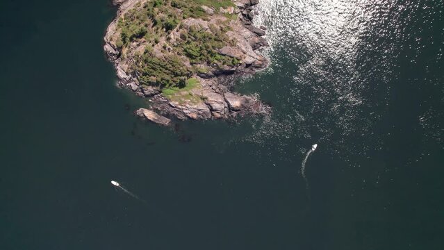 Aerial footage of ocean view near Sooke, Vancouver Island, sunny day, sea, boats, seaside. 5.4K TO 4K 24FPS