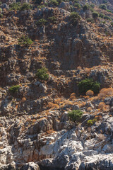 Sharp cliffs on the coast of Antalya. The texture of an acute cliff on the Turkish coast.