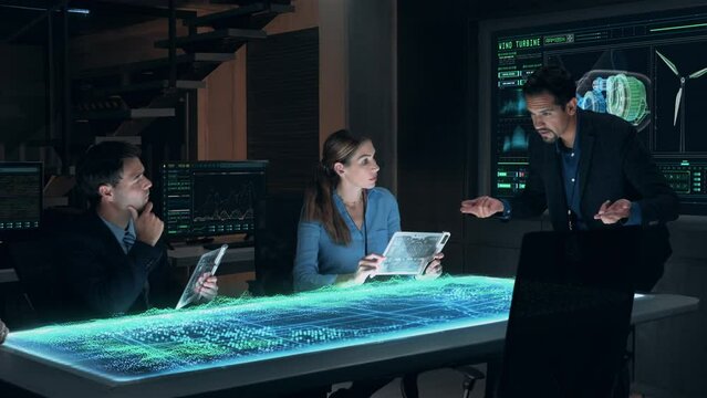 Team Meeting of Renewable Energy Engineers Working on Design of Innovative More Efficient Wind Turbines. Group of Specialists Gathered Around Holographic AR Table. Wind Farm generating Green Energy.