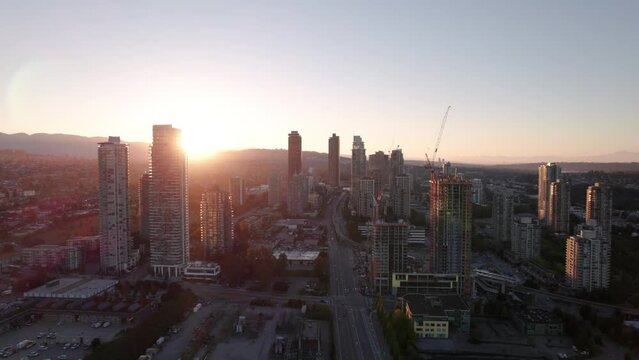 Aerial drone footage sunrise apartment buildings, sunrise skyscrapers, condominiums, real estate market Vancouver, Brentwood. 4K 4096X2304 24FPS PRORES 422