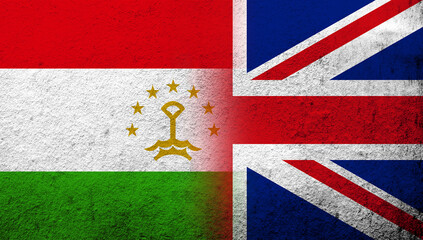 National flag of United Kingdom (Great Britain) Union Jack with The Republic of Tajikistan National flag. Grunge background