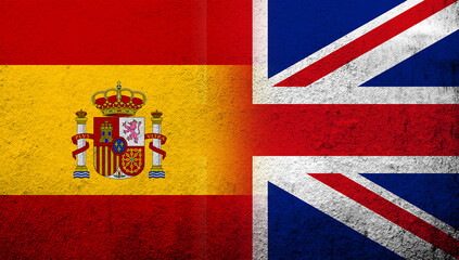 National flag of United Kingdom (Great Britain) Union Jack with Kingdom of Spain National flag. Grunge background
