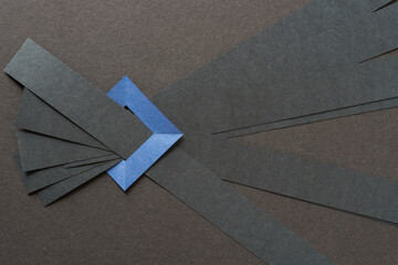 paper stripes held in place by a blue frame