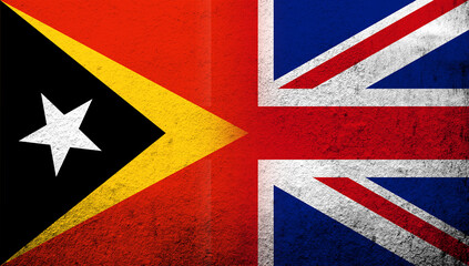 Fototapeta premium National flag of United Kingdom (Great Britain) Union Jack with Republic of Timor-Leste (East Timor) National flag. Grunge background