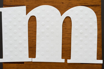 oversized letter m on wood