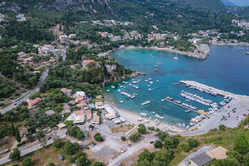 Alypa beach and marina in heart shaped beach in Palaiokastritsa village, Corfu Island, Greece