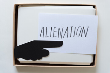 index card with the word "alienation" and a pointing finger