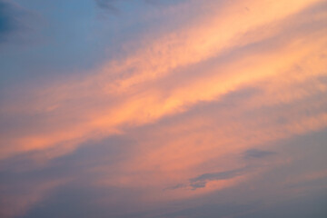 Beautiful bright sunset on the sky, sky with clouds in the evening