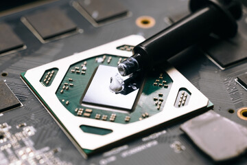 Applying thermal paste on the computer's central processing unit, computer repair