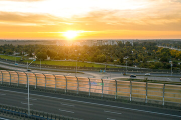 Fototapeta na wymiar Autobahn and sunset in the background, road