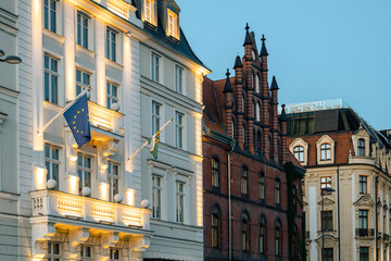 Fototapeta na wymiar EU flag on government building, illuminated EC flag