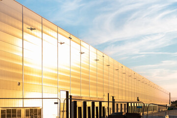 Large logistics warehouse for storing and sorting goods, view from the outside of the building