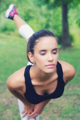 Young woman exercise in the summer nature