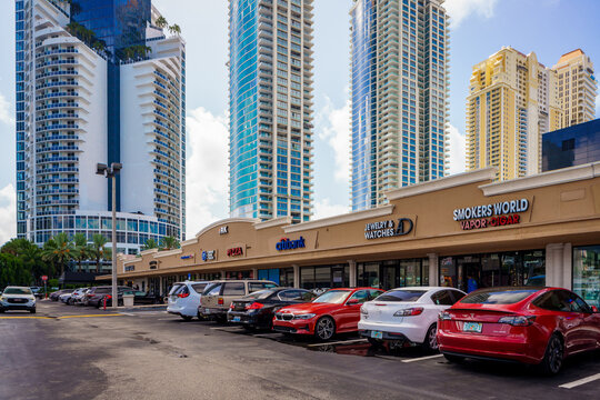 Businesses in Sunny Isles RC Center with view of highrise tower condos on the beach