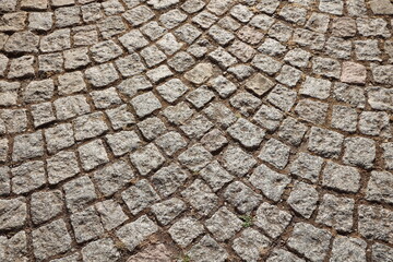 Pattern bricks pavement closeup old european road of stones and bricks
