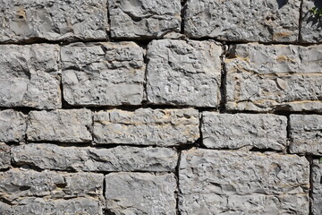 Wall made of bricks, old wall in europe created from big concrete blocks