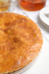 Delicious pie with meat on white table