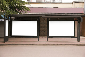 Blank advertising boards on transport stop. Space for design