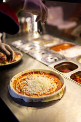 pizza boutique delicious background bakery food styling cheese making chef in kitchen before oven costumers friends happy eating slices