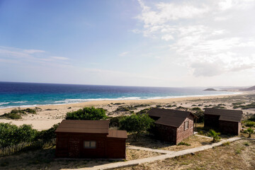 Fototapeta na wymiar blue sunny sky silent vacation cottage beach touristic place 